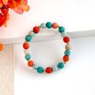 The Kantha Capri Sonnet Bracelet features groups of colorized Kantha beads separated by smaller metallic beads.