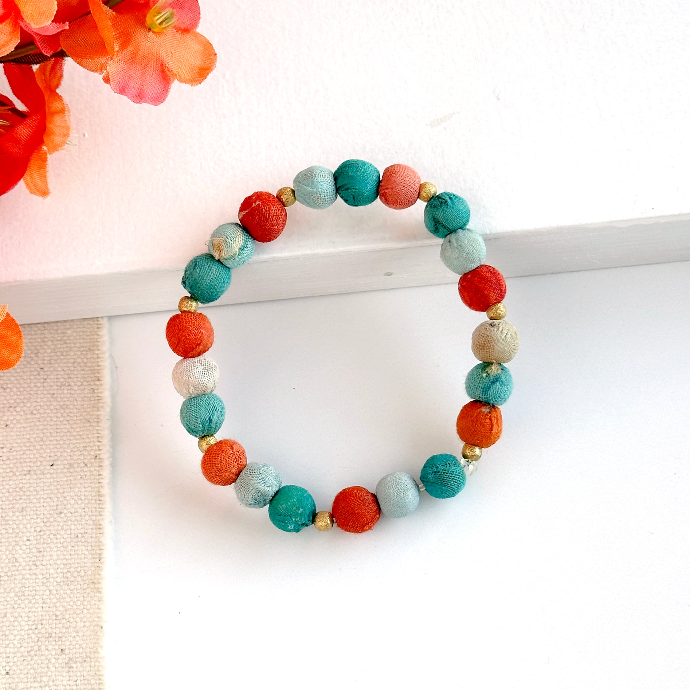 The Kantha Capri Sonnet Bracelet features groups of colorized Kantha beads separated by smaller metallic beads.