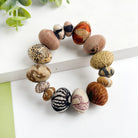 Kantha Desertscape Coterie Bracelet that is made of unique, super large oval-shaped Kantha beads alternate with smaller-sized ovals to create this incredible statement style.