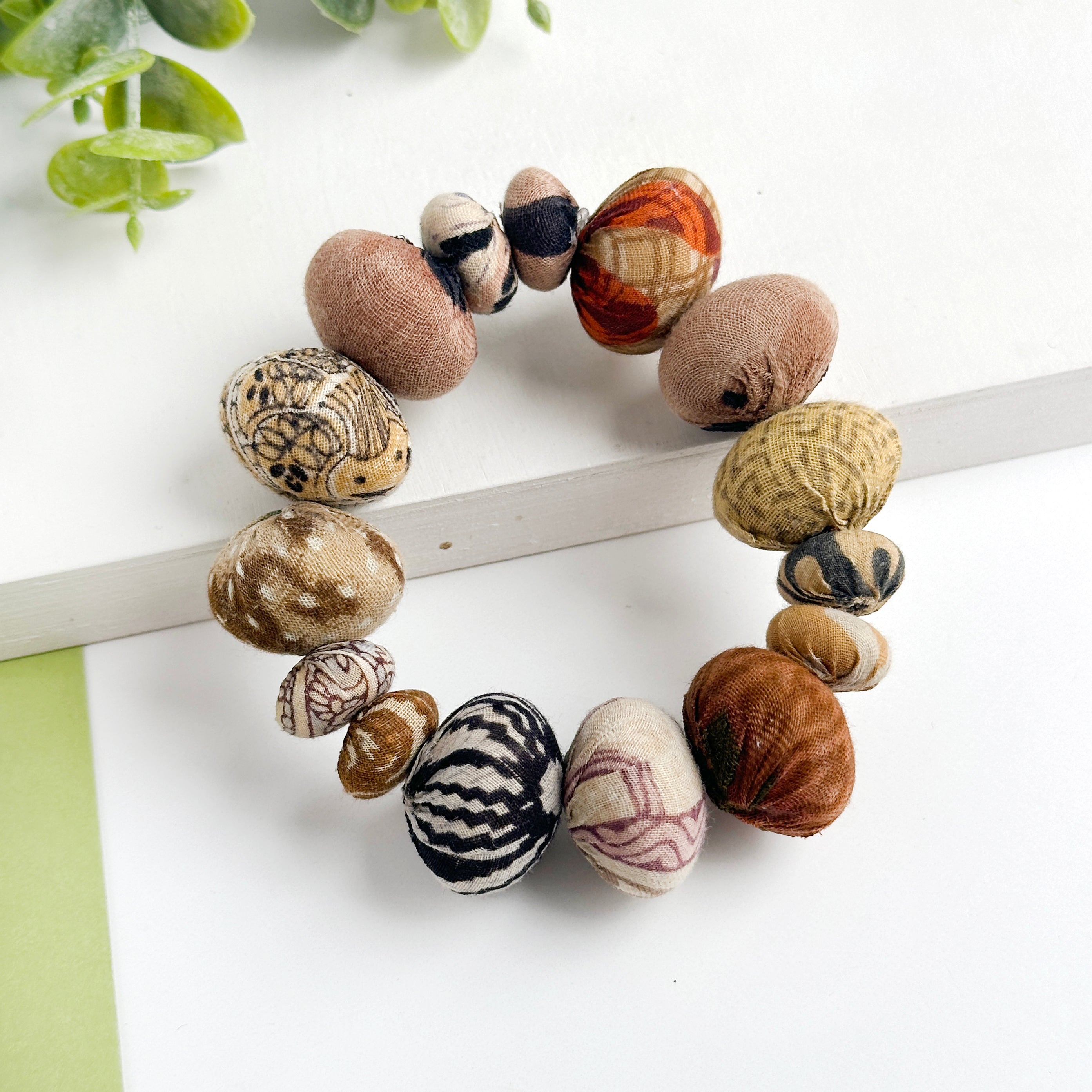 Kantha Desertscape Coterie Bracelet that is made of unique, super large oval-shaped Kantha beads alternate with smaller-sized ovals to create this incredible statement style.