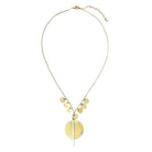 A gold disc necklace is shown against a white background.