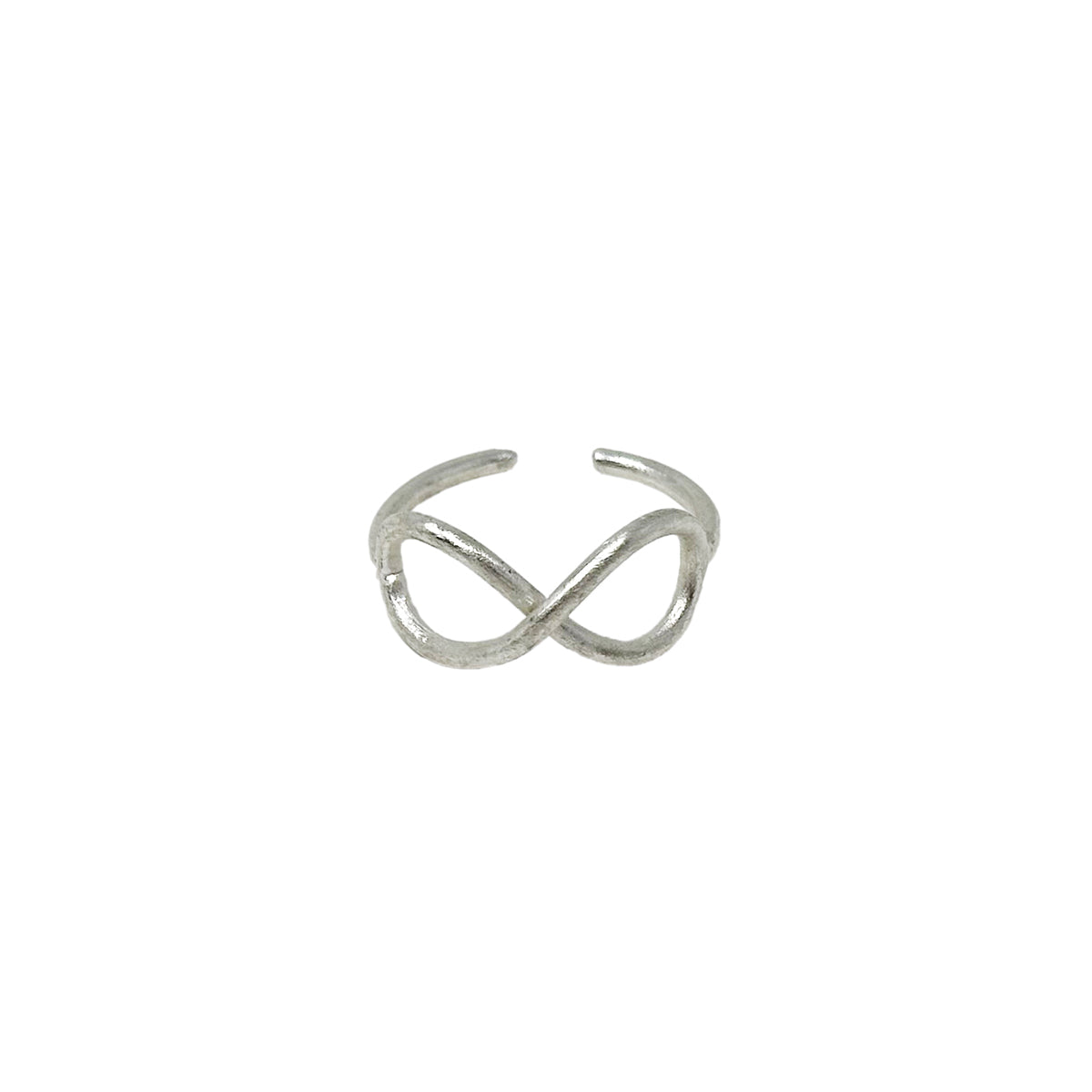 A silver ring with center infinity sign motifs is seen against a stark white background.