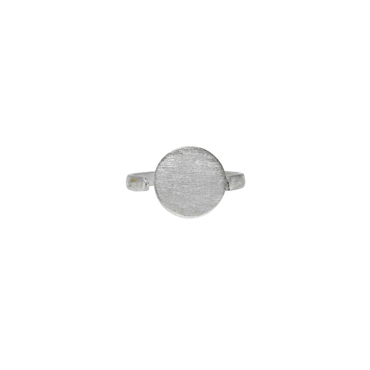 A silver ring with a large circle center motif is shown against a white background.
