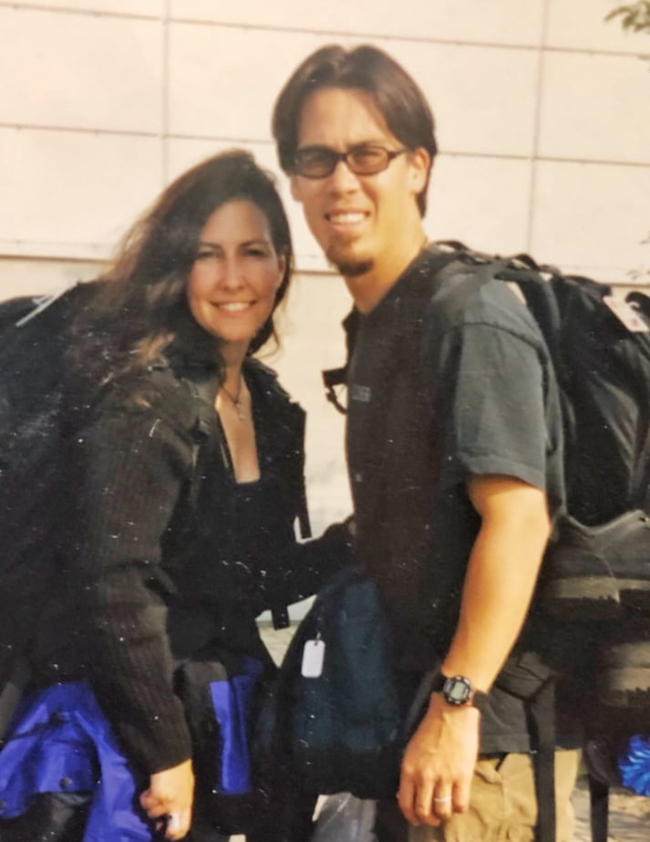 Kelly Weinberger & David burns smile for the camera before boarding a flight