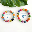 Two multicolor, beaded bracelets are side-by-side with measurements in the center of each bracelet.