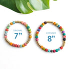 Two multicolor beaded bracelets sit on a white background next to each other. One is visibly larger. The smaller one has text in the center that reads "Original 7". The other has "Extended. 8"