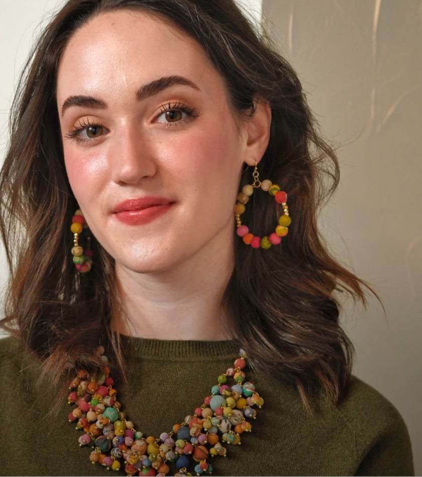 A woman models a pair of Kantha earrings