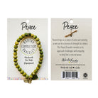 The front and back of a carded beaded bracelet against a white background.