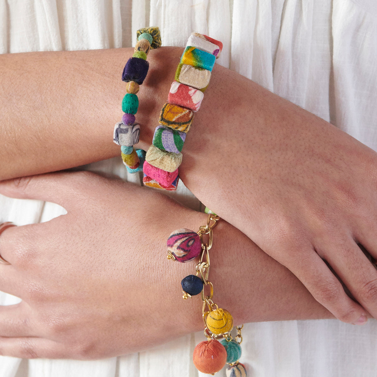 A model wears the Kantha Bauble Charm Bracelet.