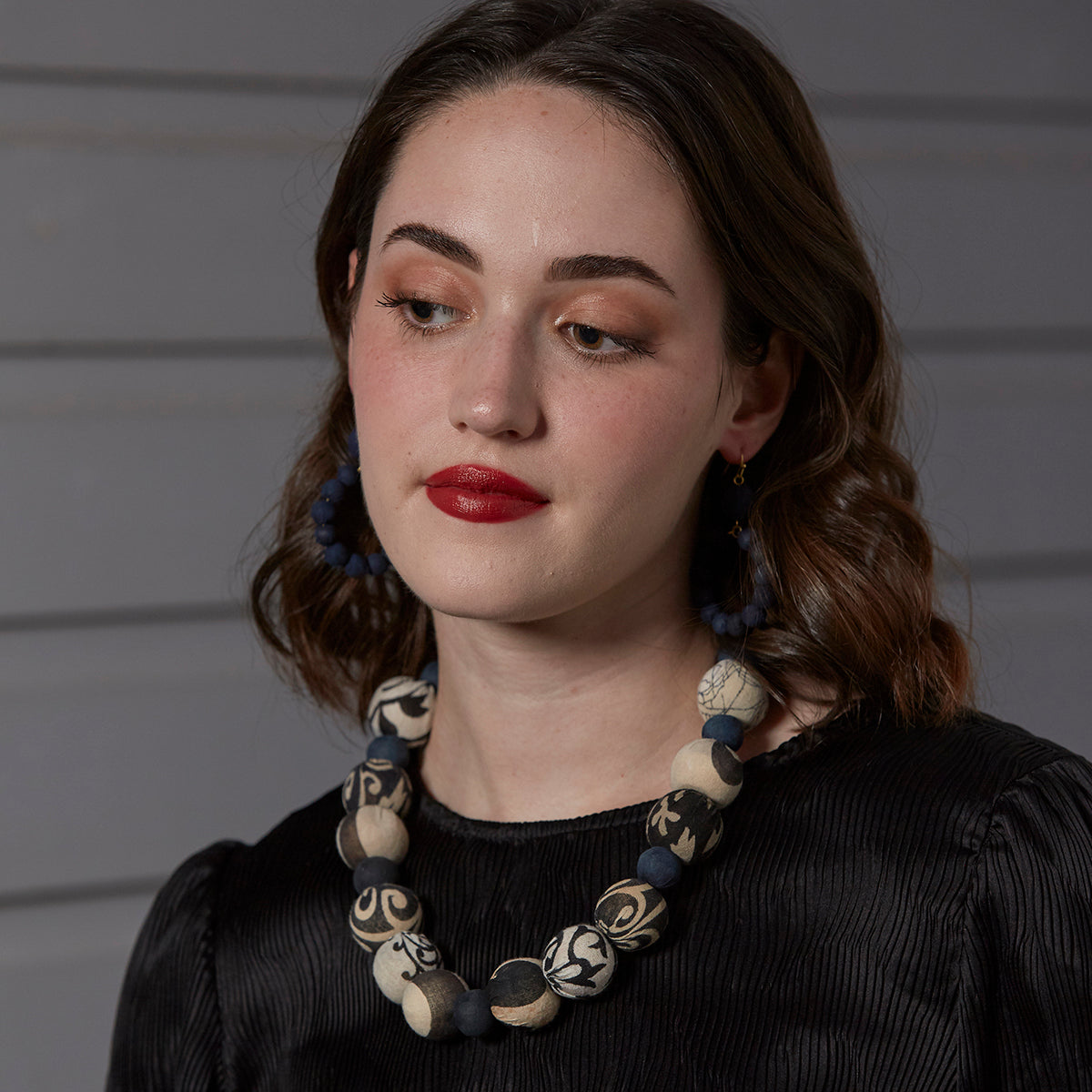 A model wears the Kantha Indigo Bauble Necklace.