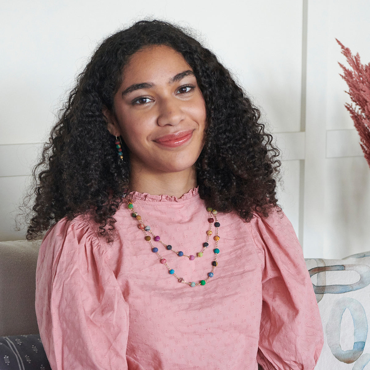 A woman wears a fair trade Dotted Kantha Long Necklace.