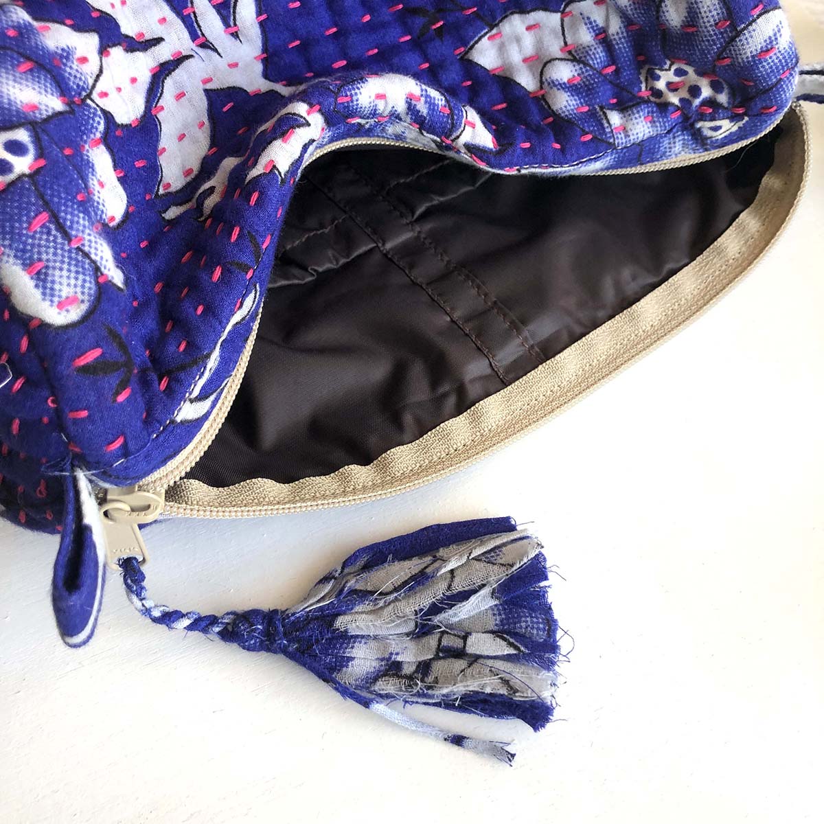 A blue Kantha Makeup Bag.