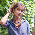A model wears the Cascading Kantha Necklace.