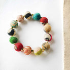 A multicolor beaded bracelet against a white background.