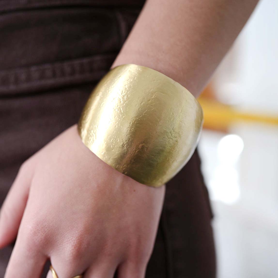 A woman models the Cabochon Cuff.