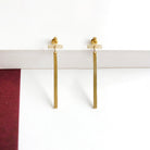 Dangling Bar Posts in Gold