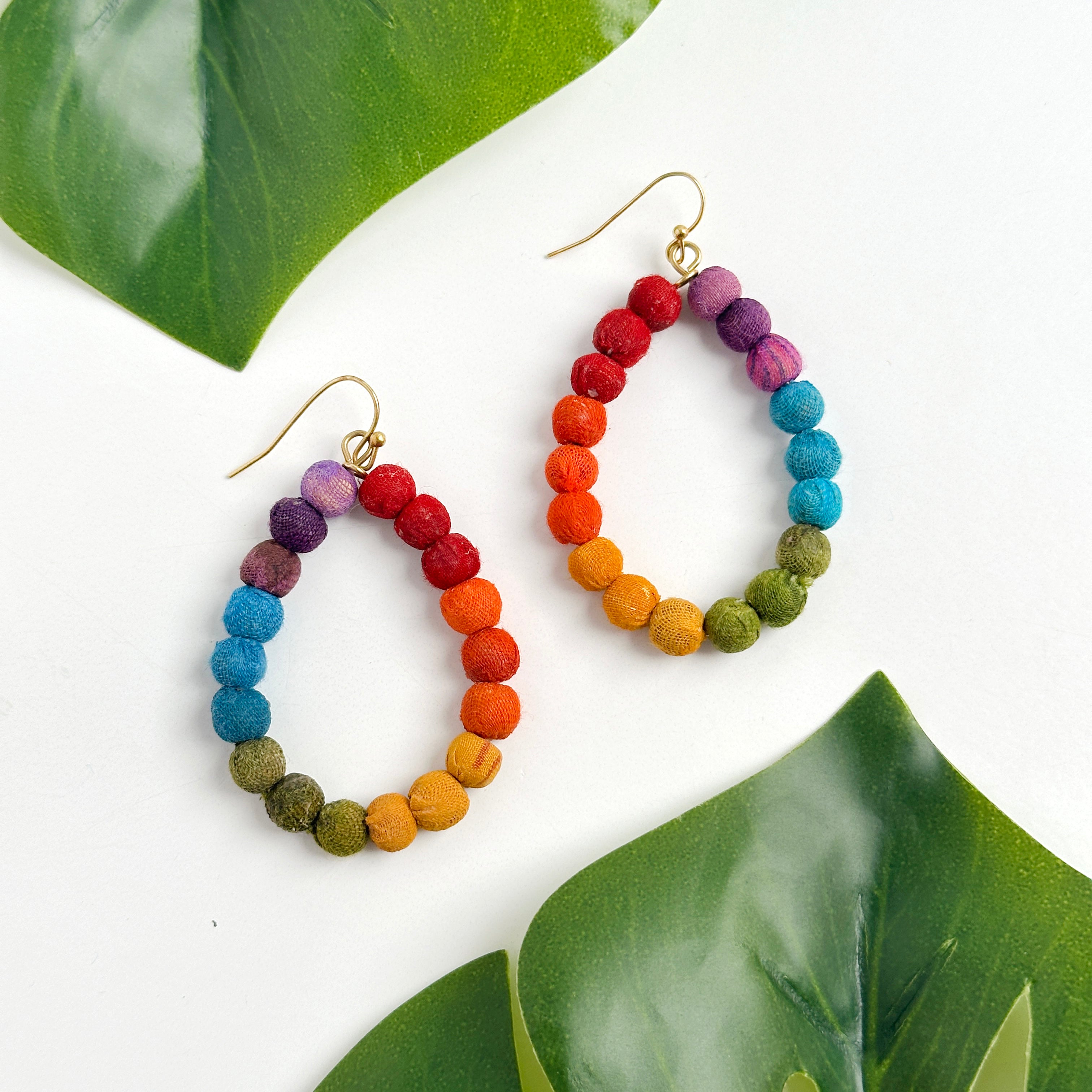 Kantha Prism Earrings made of beads that have been sorted and arranged into vibrant, color-blocked sections for an multichromatic rainbow-like display of color.

