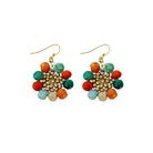 Kantha beads surround a circle of matte gold seed beads in a playful flower shape to form the Kantha Capri Sunflower Earrings.