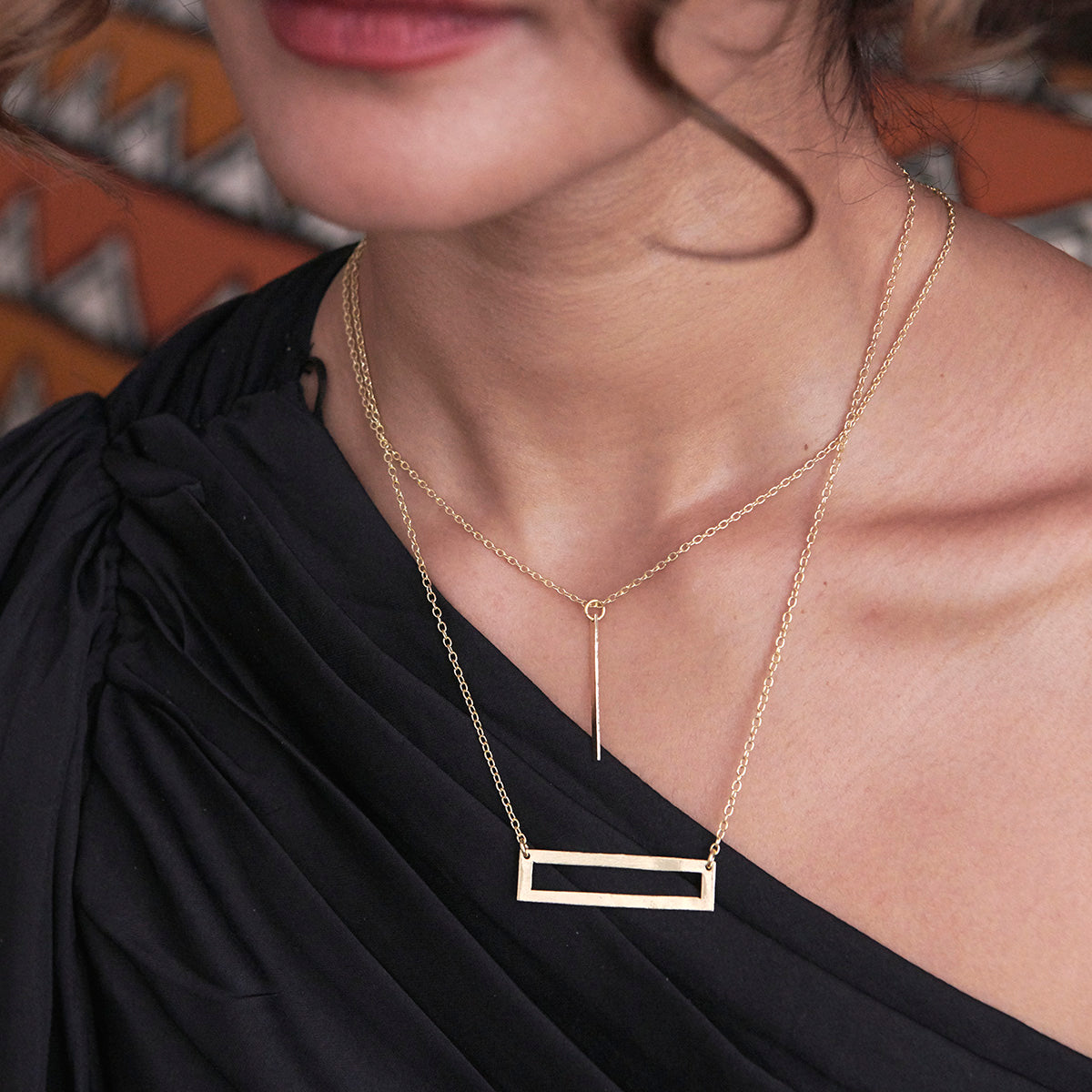 A model wears the Dangling Bar Pendant Necklace.