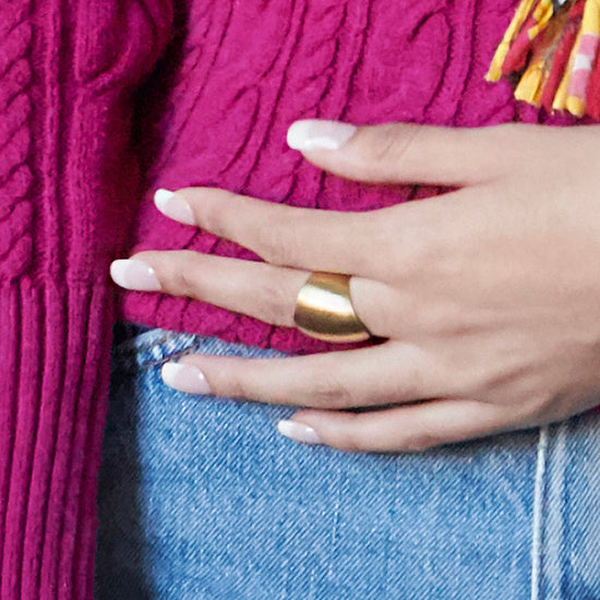Load image into Gallery viewer, A woman&amp;#39;s hand is shown with a single gold ring.
