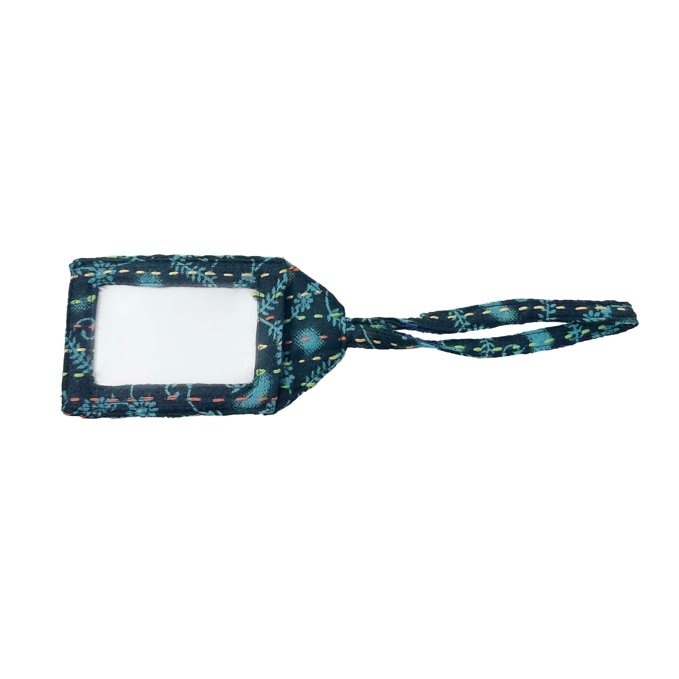 Kantha Luggage Tag that is made from recycled Kantha textiles, so colors and patterns are all one-of-a-kind and will vary. 