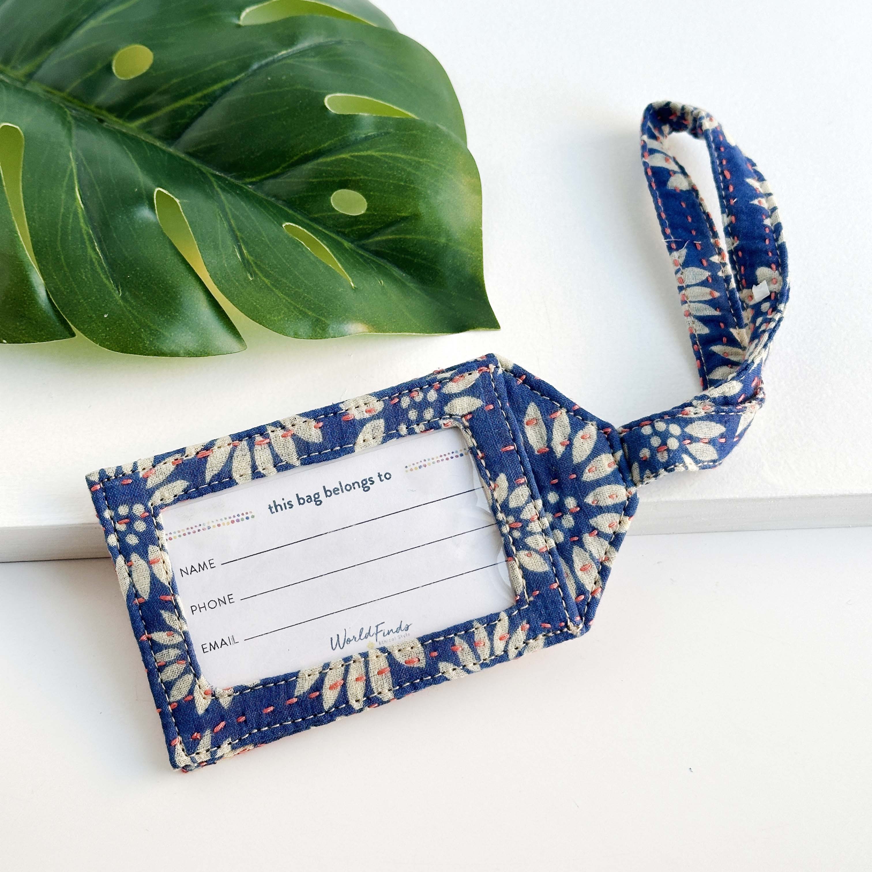 Kantha Luggage Tag that is made from recycled Kantha textiles, so colors and patterns are all one-of-a-kind and will vary. 