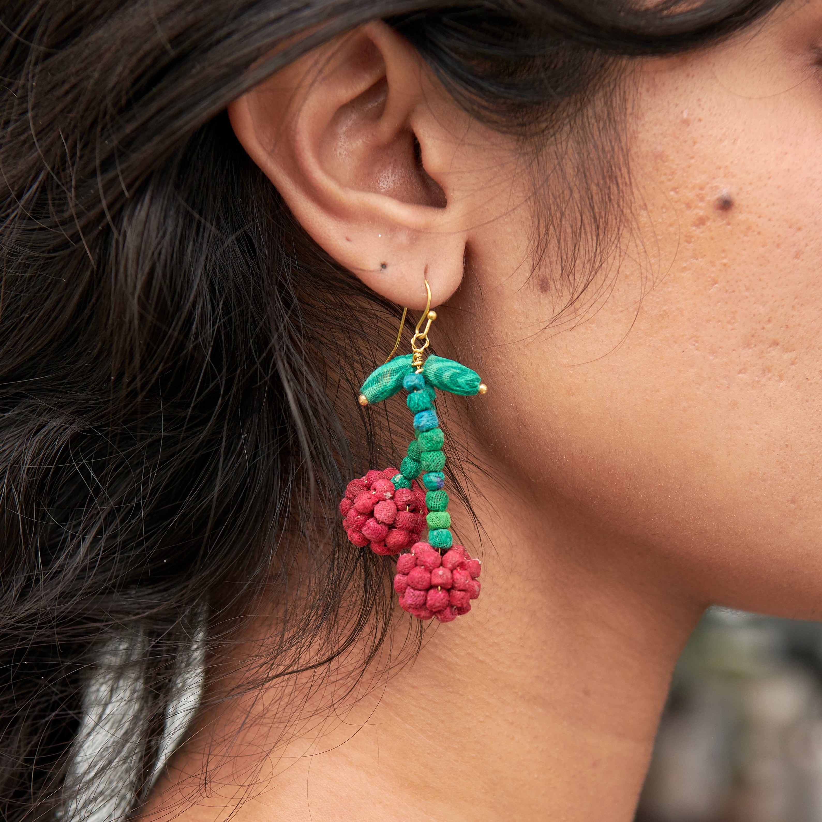 Model wearing colorful Kantha Cherry Earrings.