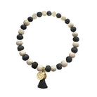A black and white beaded bracelet against a white background.