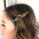 A Kantha Cluster Hair Pin adorns a woman's hair.