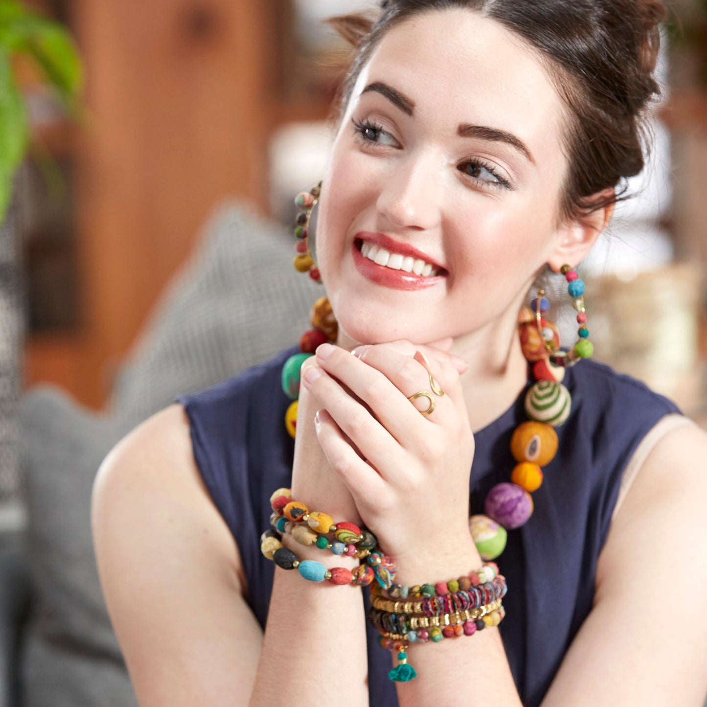 A woman models the Fractal Kantha Spiral Bracelet.