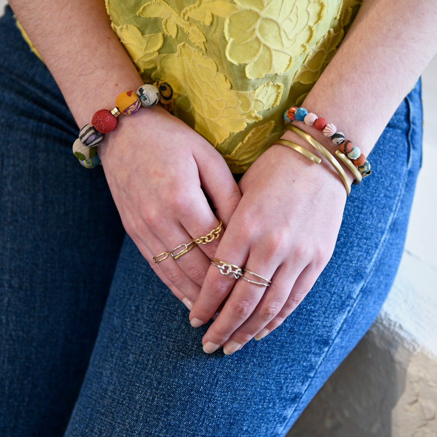 Load image into Gallery viewer, A woman wears the Kantha Linear Bar Bracelet.
