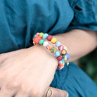 A model wears the Kantha Overlap Bangle.