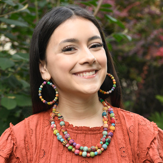 A model wears the Kantha Tandem Necklace along with other handmade jewelry.