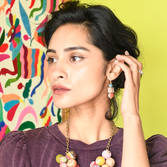 Load image into Gallery viewer, A woman models the Kantha Shapes Drop Earrings.
