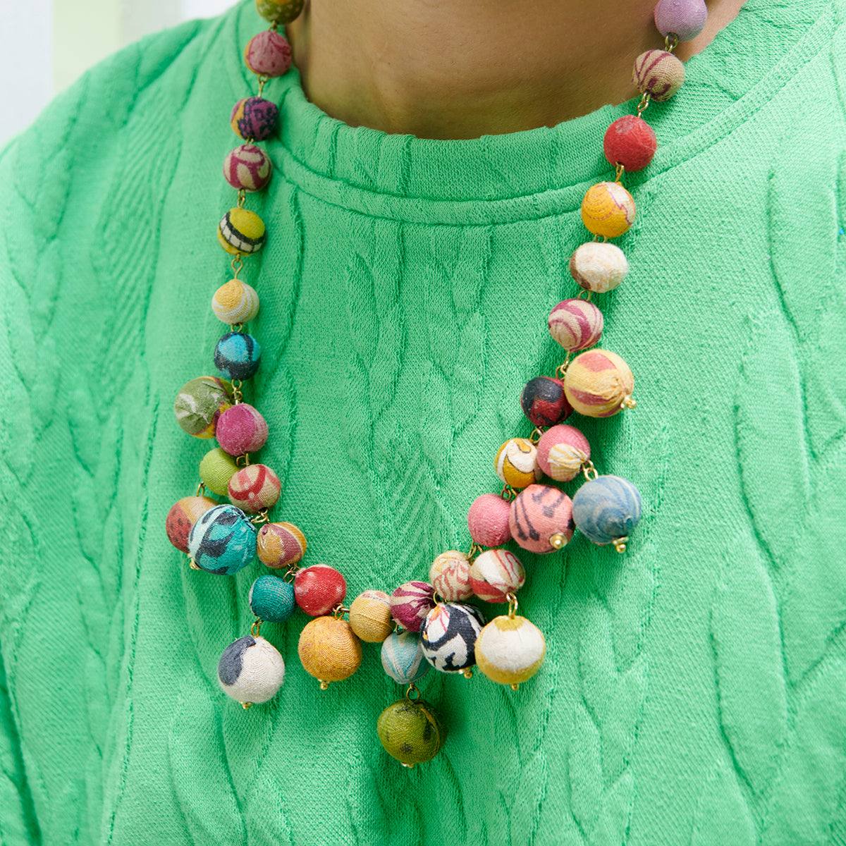 A close up of the Kantha Bloom Necklace