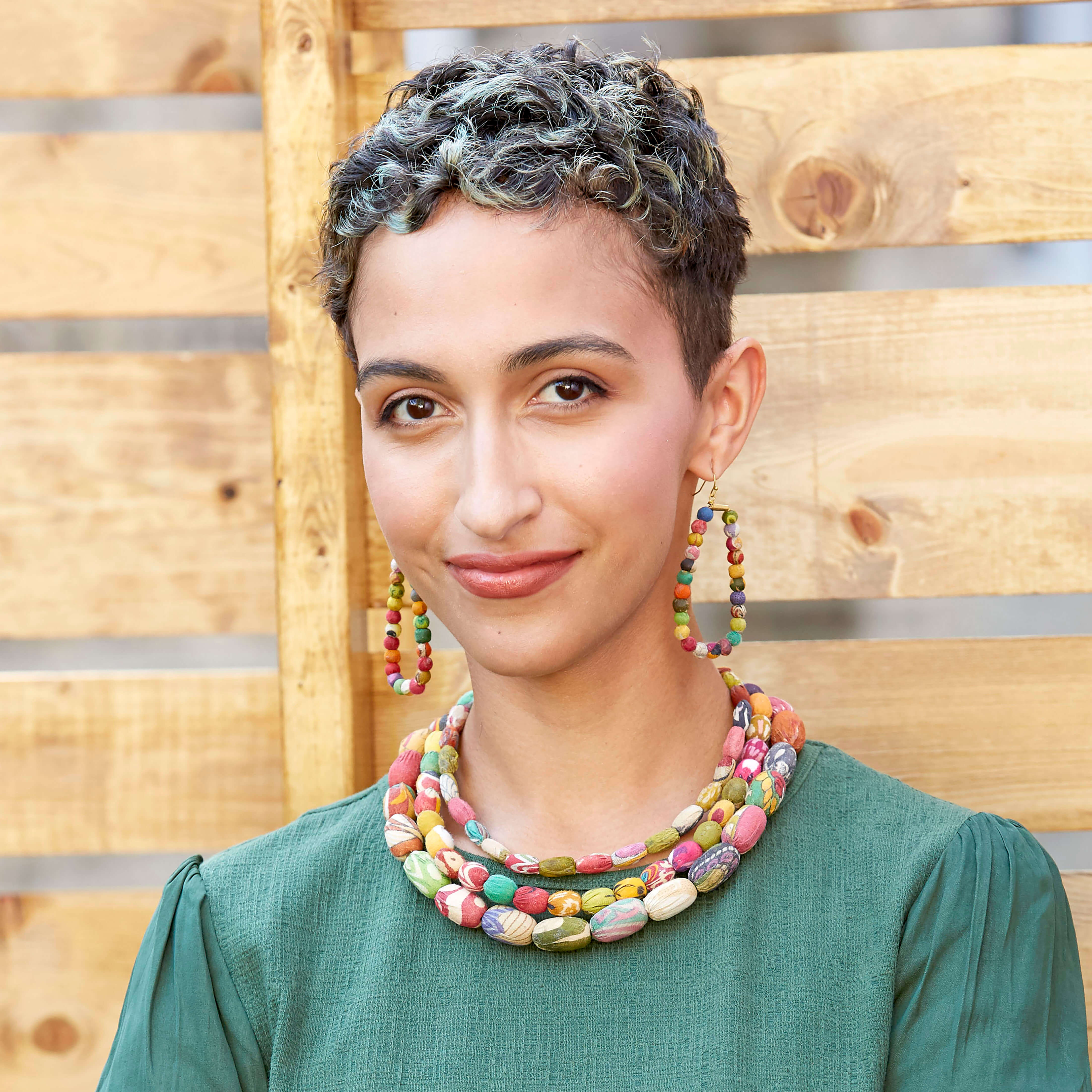 A woman models the Kantha Oblong Hoops.