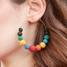 Galaxy Graduated Hoops are seen on ear.