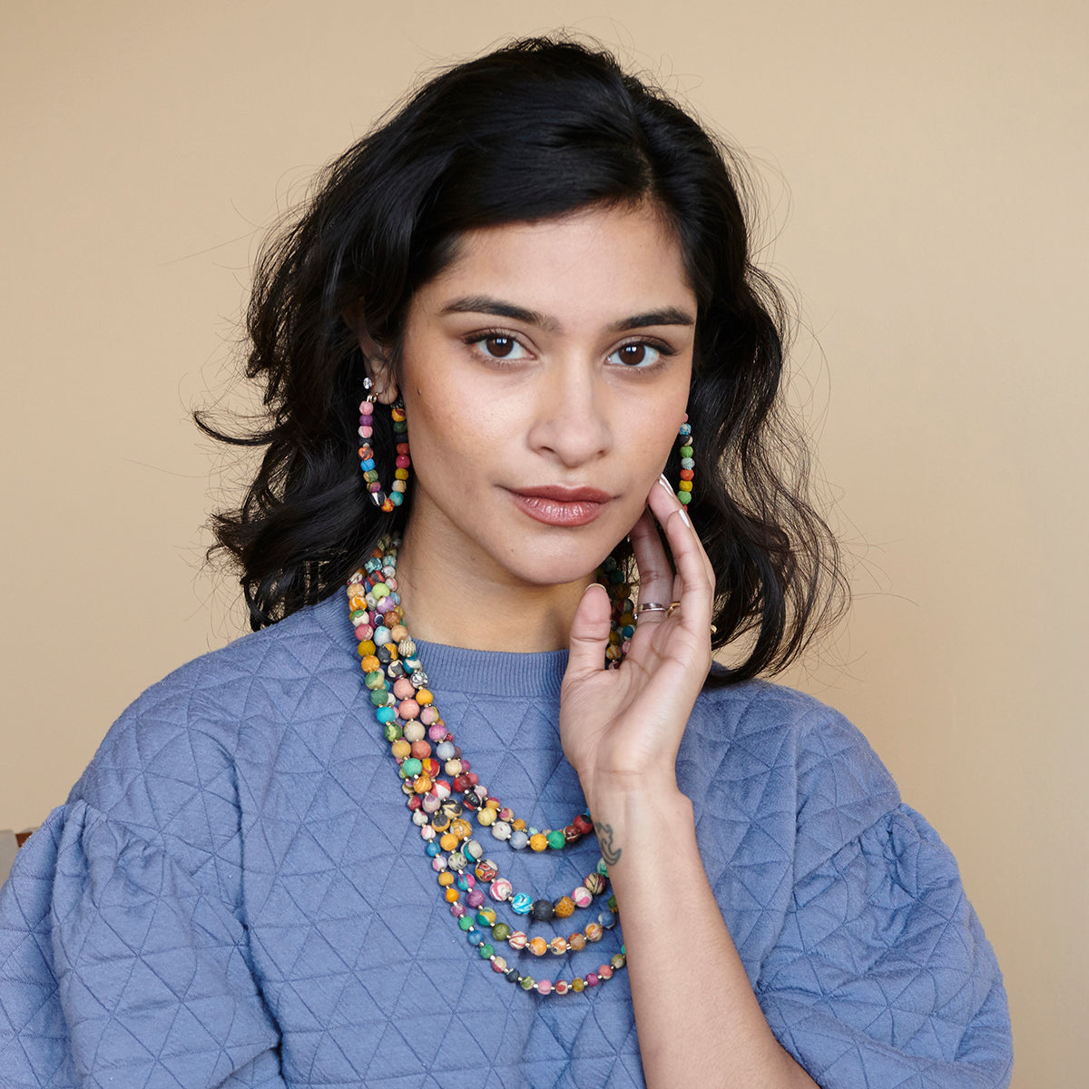 A woman models the Kantha Elliptical Hoops.