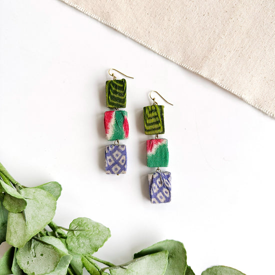 Load image into Gallery viewer, A pair of earrings is shown. These earrings are formed with three rectangular beads hanging vertically from ear wires.
