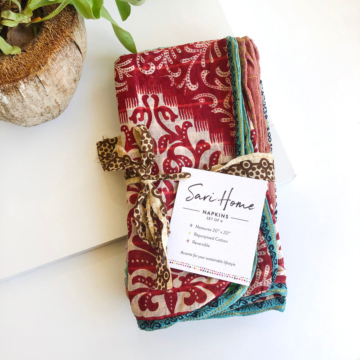 A stack of Sari Home Napkins