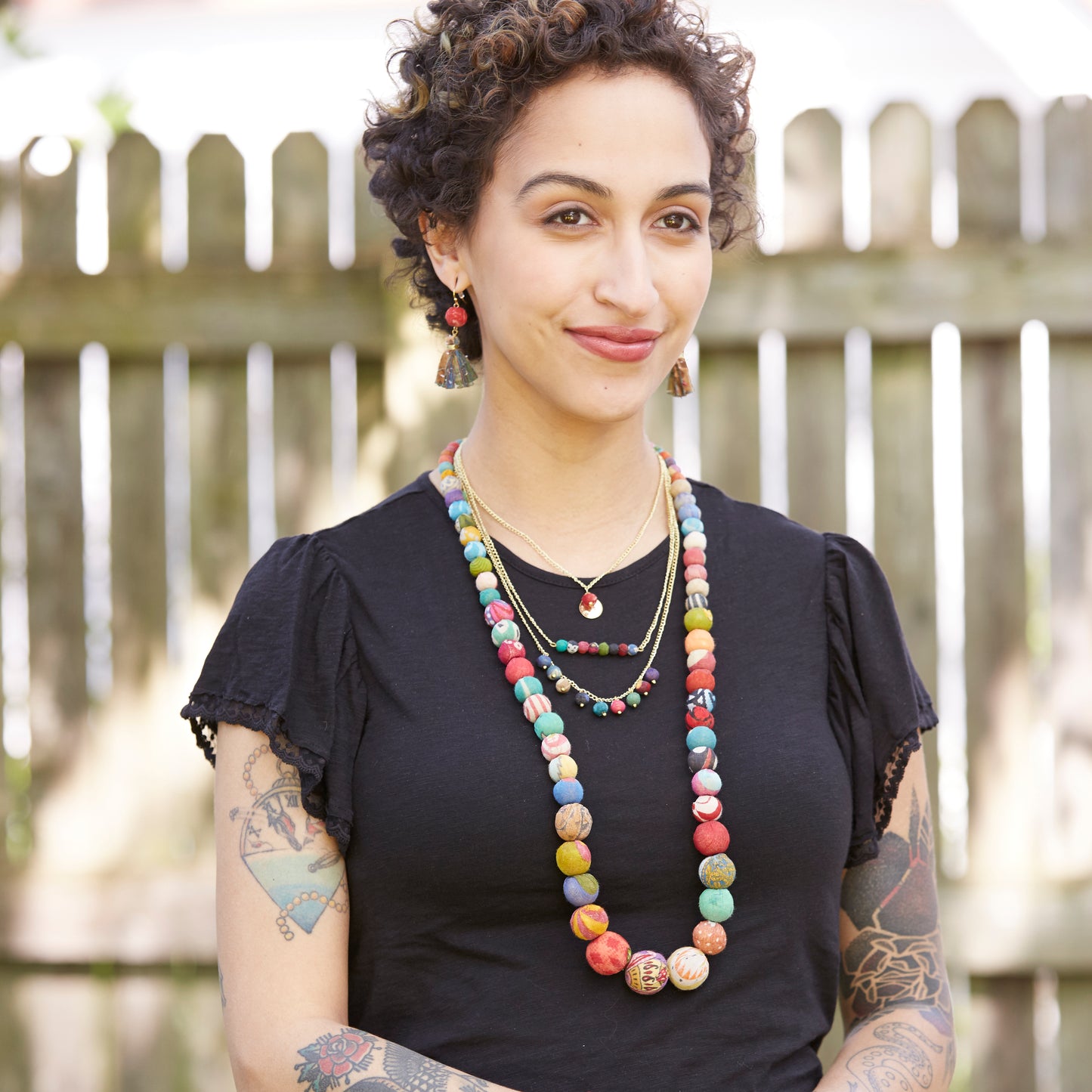 A model wears the Kantha Kali Necklace along with other fair trade kantha jewelry.