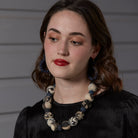 A model wears the Kantha Indigo Bauble Necklace.