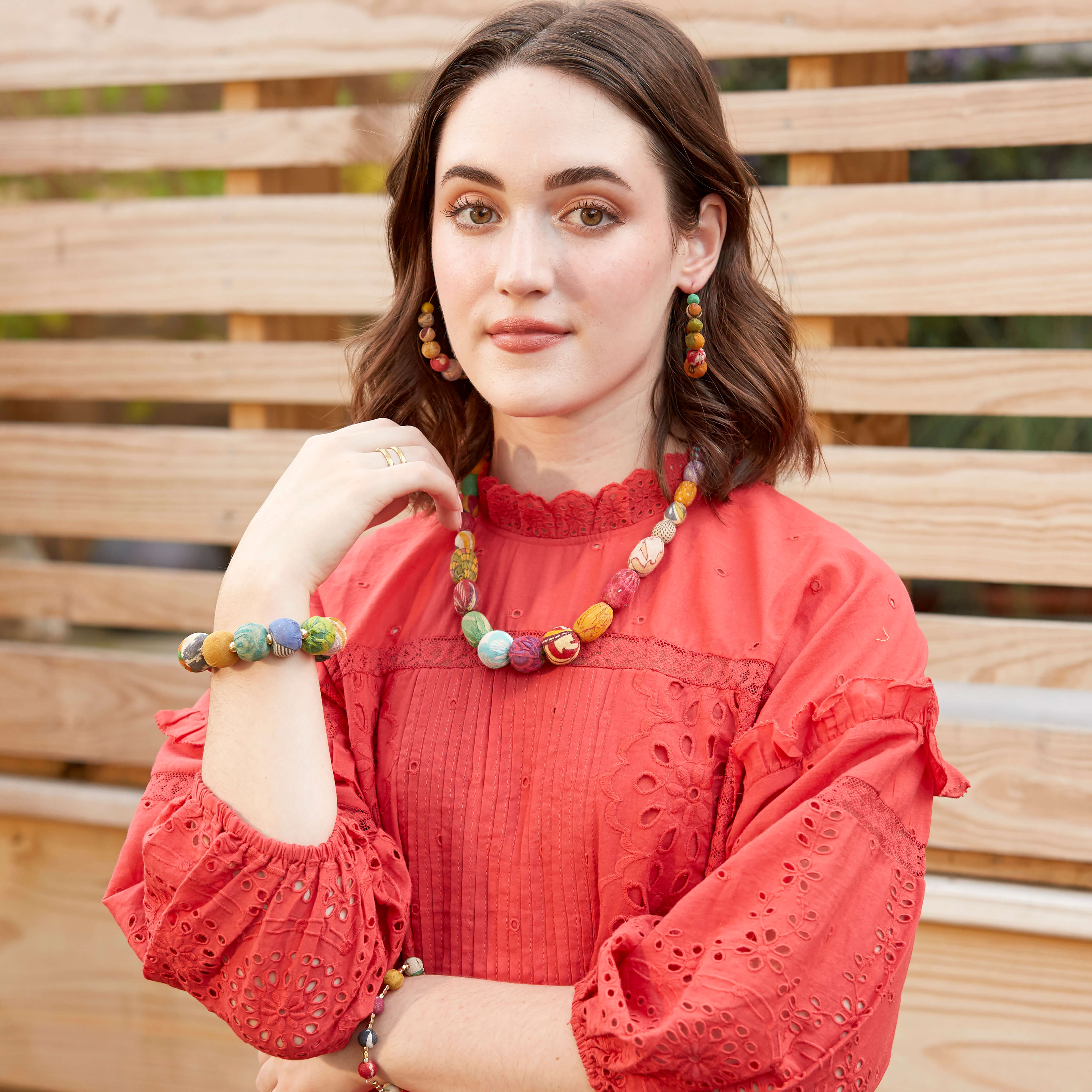 A model wears the Kantha Halcyon Necklace along with other fair trade jewelry.