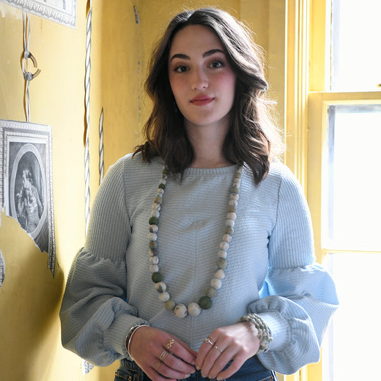 Load image into Gallery viewer, A model wears the Kantha Waves Necklace.
