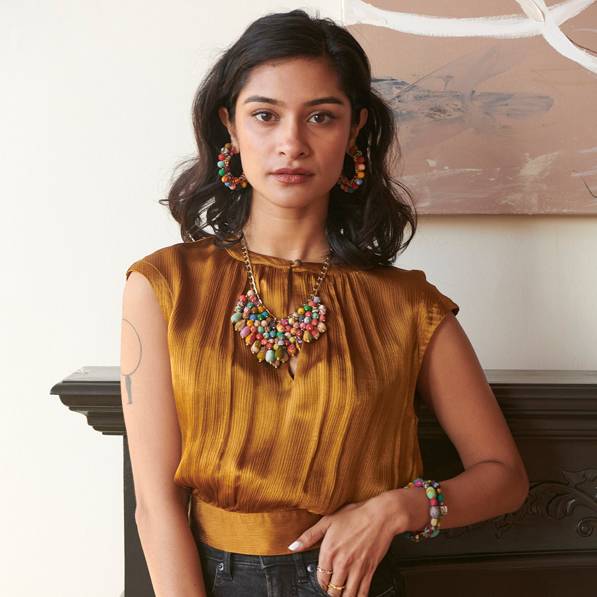 A model wears the Kantha Waterfall Necklace and Confetti Hoops.