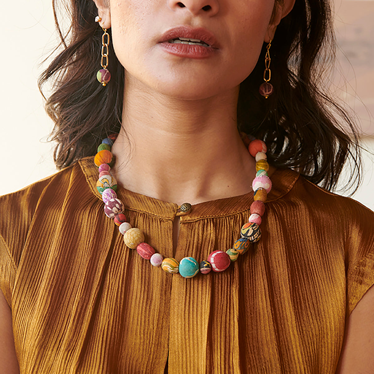 A model wears the Kantha Calysta Necklace.