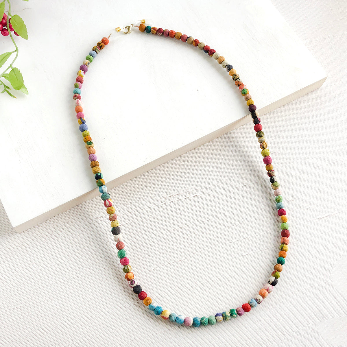 Load image into Gallery viewer, Kantha Eyeglass Chain can be worn as a necklace.
