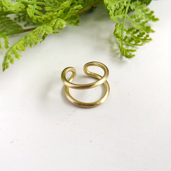 A single gold Double Arch Ring.