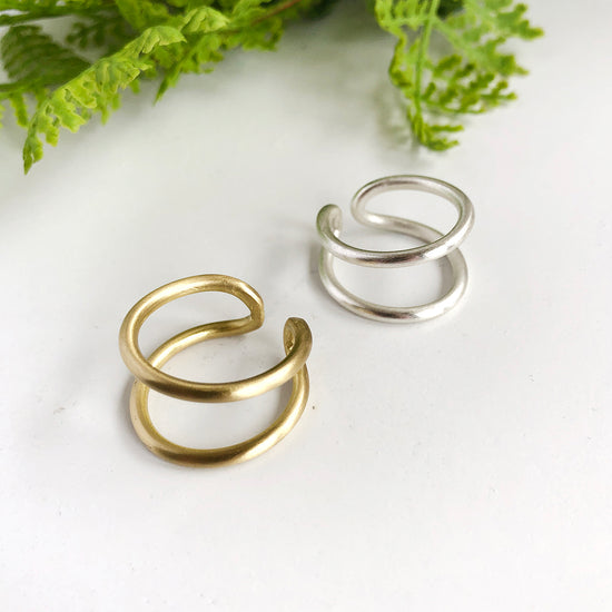 Two Double Arch Rings, one in gold and one in silver