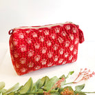 A red Kantha Makeup Bag.